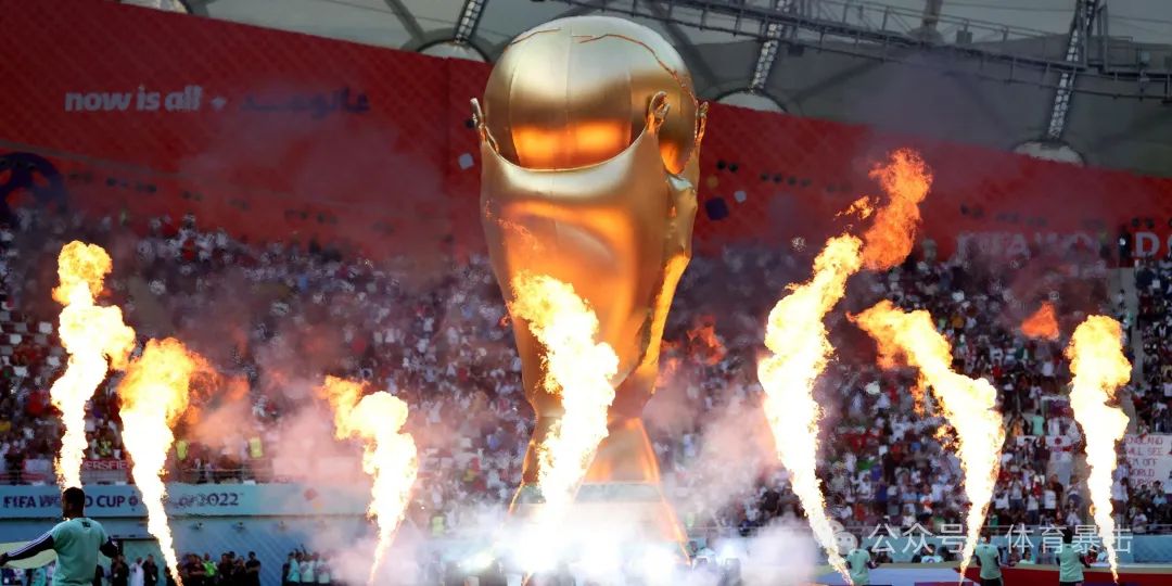 A giant replica of the World Cup trophy surrounded by flames